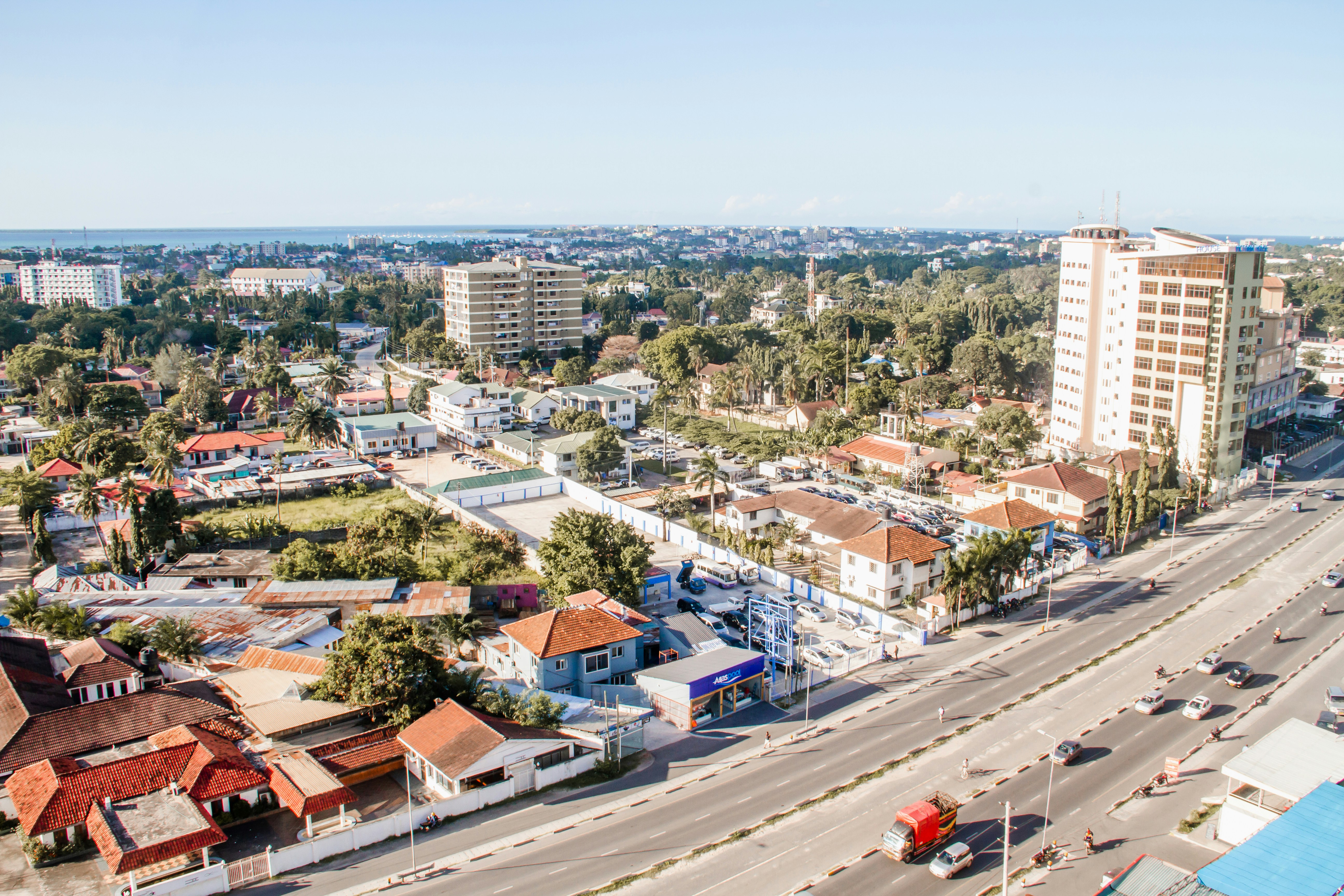 an aerial view of a city with tall buildings