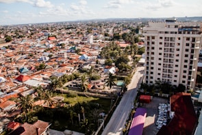 An aerial view of a bustling residential neighborhood in Ajman highlighting apartment buildings.