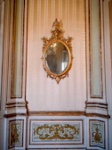 Custom large wall mirror installed in a stylish living room with elegant decor.