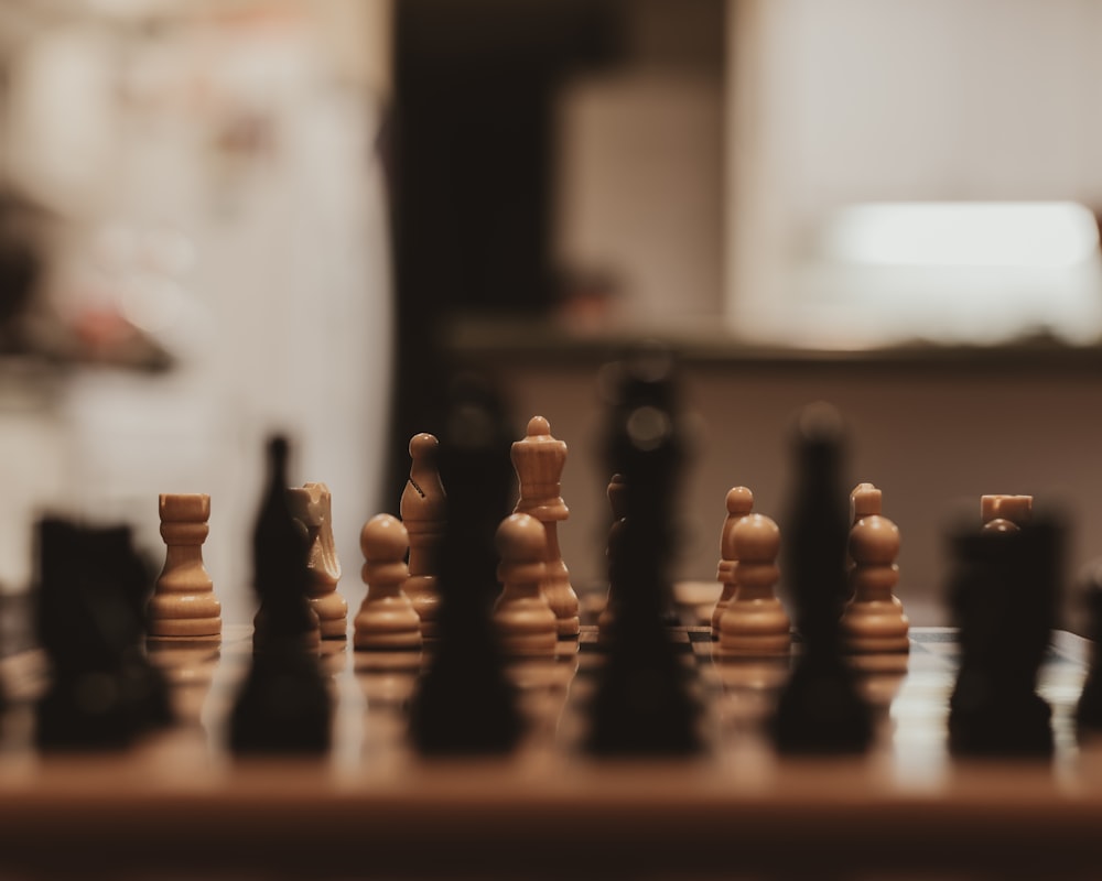 a close up of a chess board with pieces on it