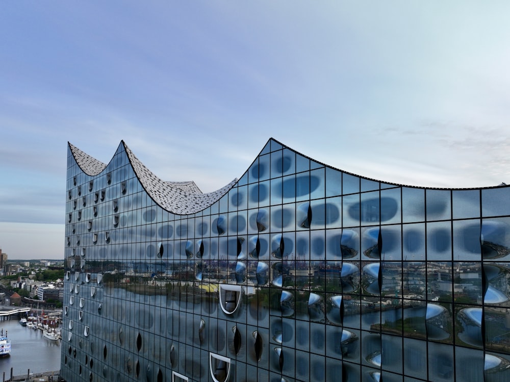 a large building with a curved glass facade