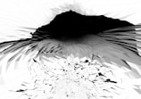 A digital artwork featuring an abstract design composed of geometric patterns in black, white, and shades of gray that create a sense of depth and movement. The shapes form a vortex-like structure that appears to be collapsing inward.