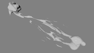 A grayscale still from an experimental animation showing abstract shapes in motion against a stark background.