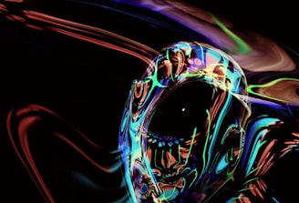 An abstract, futuristic image featuring a human-like figure with an iridescent, reflective surface surrounded by swirling neon lights and colors in a dark environment.