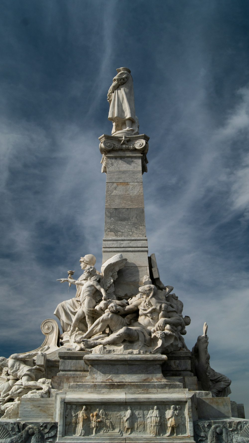 a statue of a woman with a horse and a man