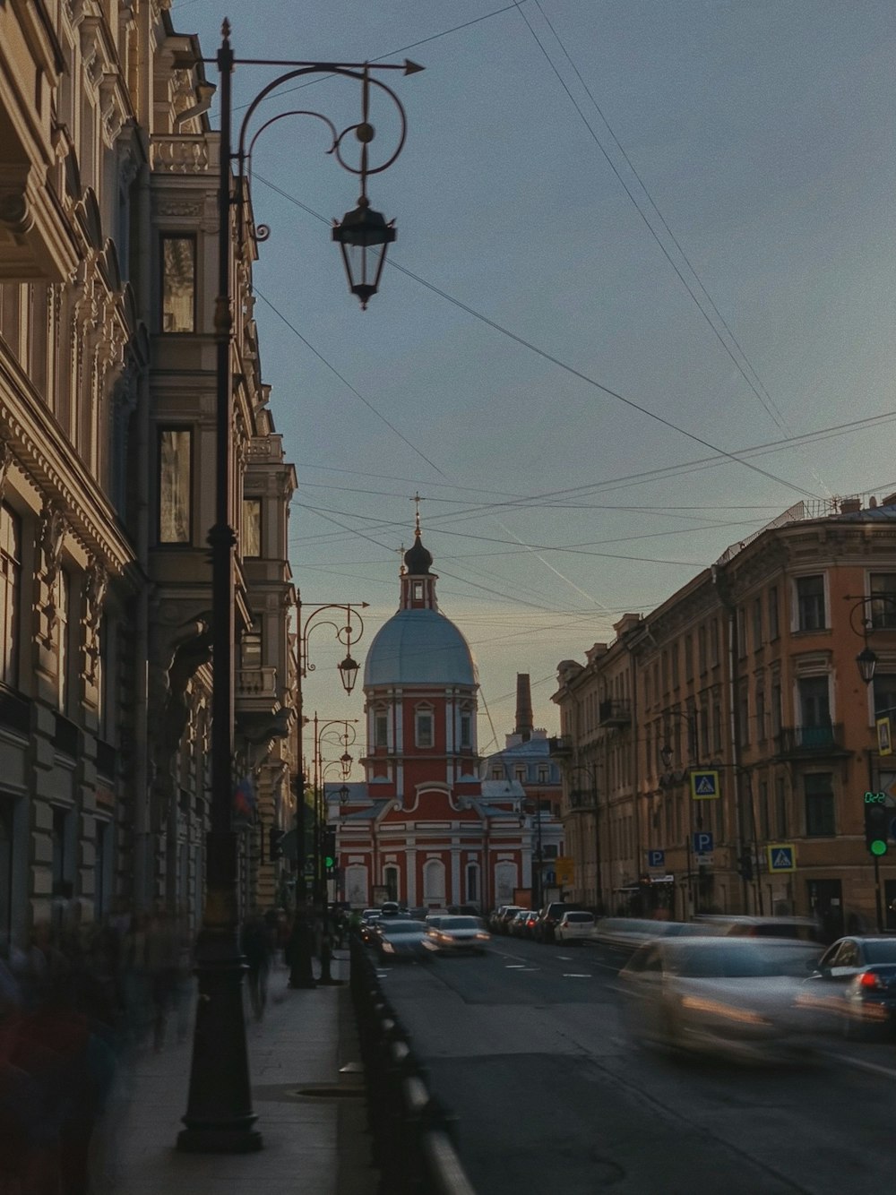 a city street with cars driving down it