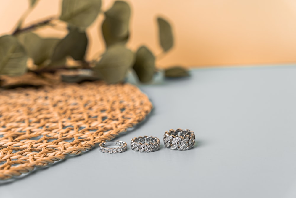 a pair of earrings sitting on top of a table