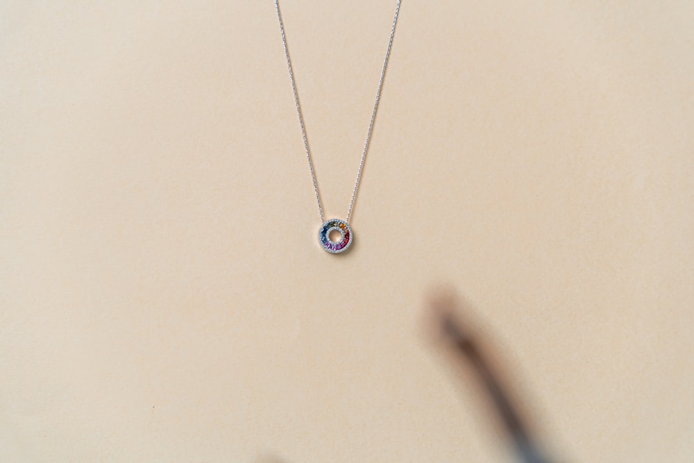 a close up of a necklace on a table