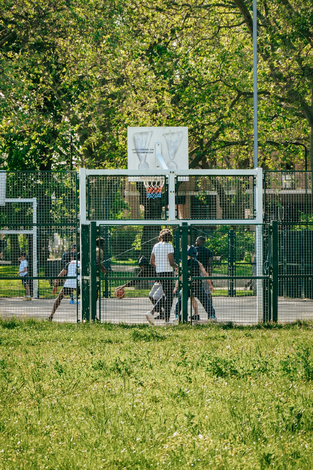 a group of people playing a game of basketball