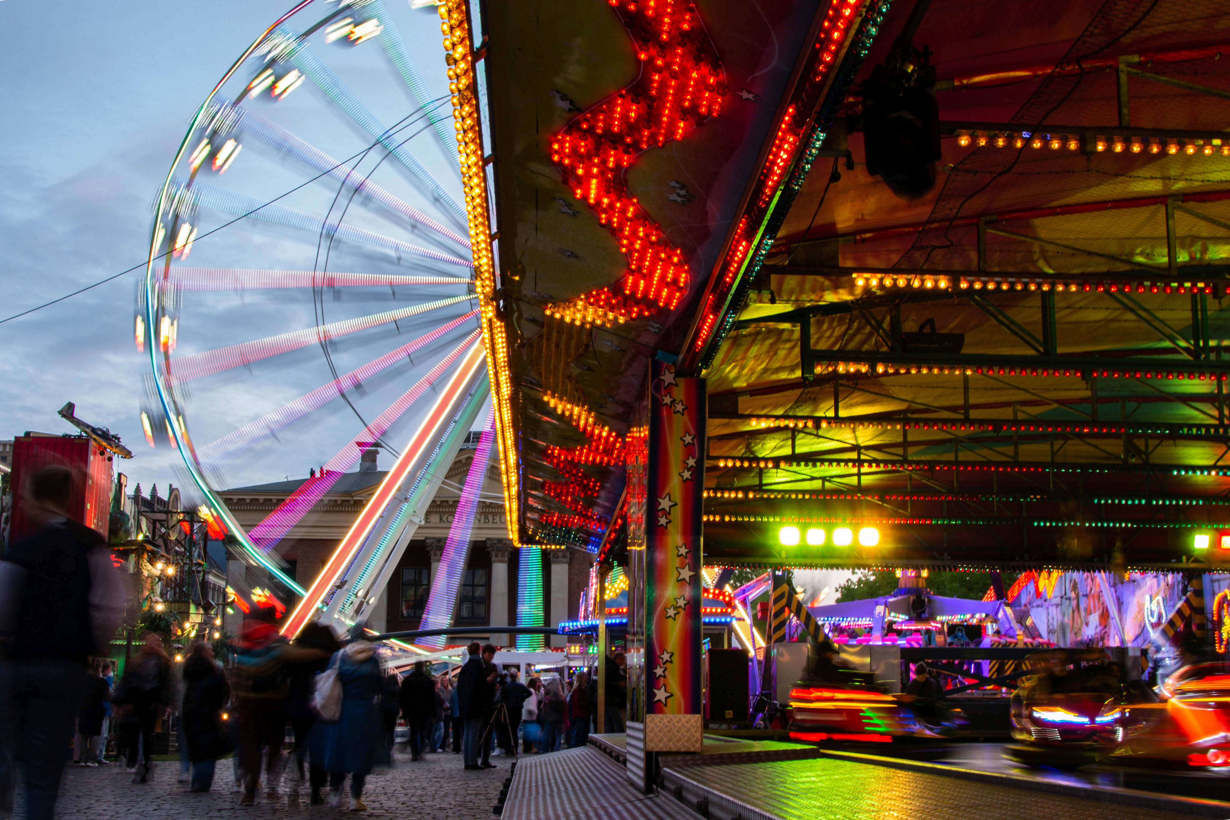 groningen - a carnival with a ferris wheel in the background