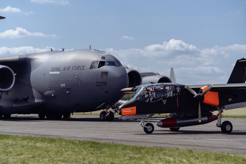 a large air force jet sitting on top of an airport runway