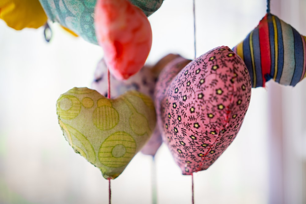 a group of hearts hanging from a string