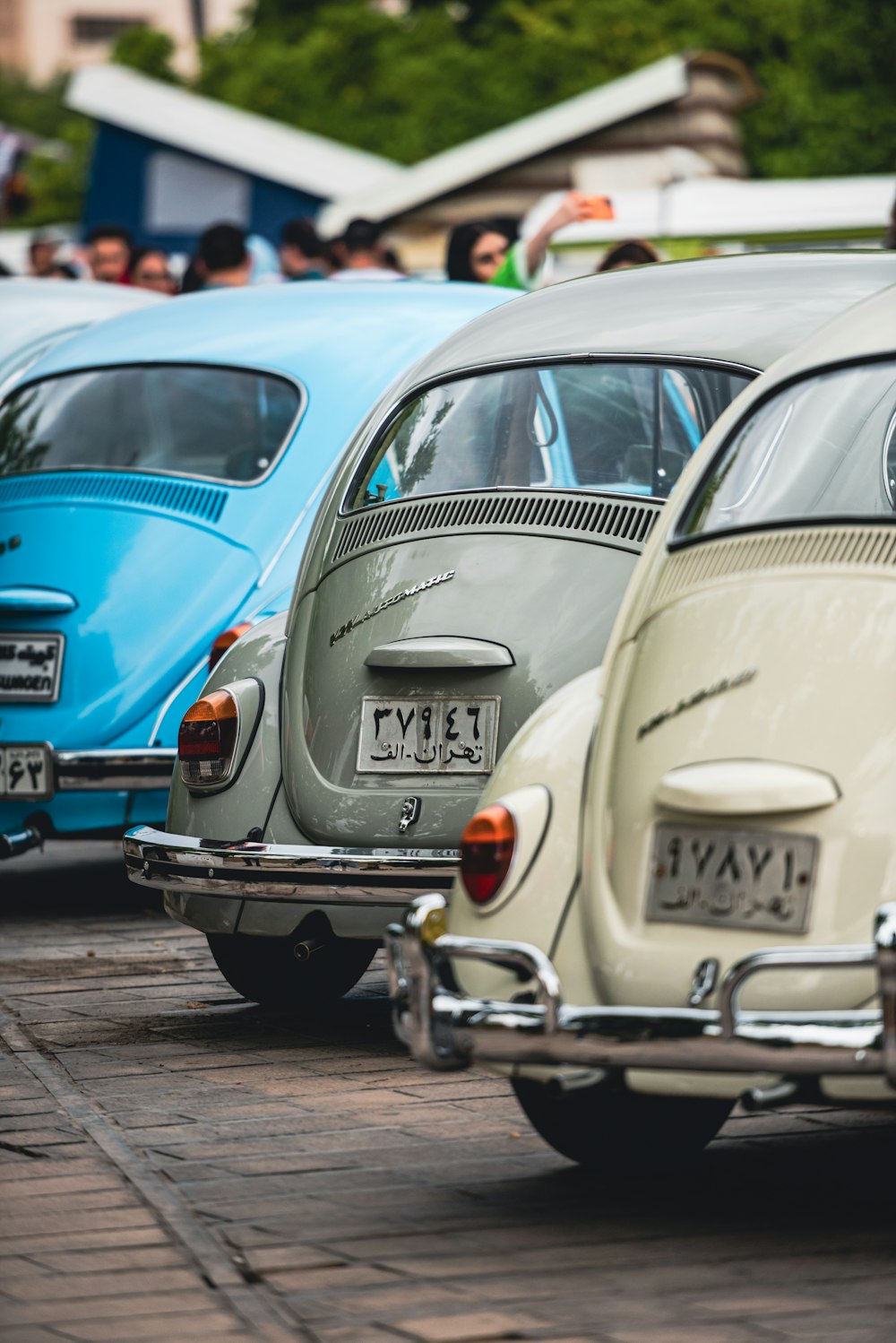 a row of old cars parked next to each other