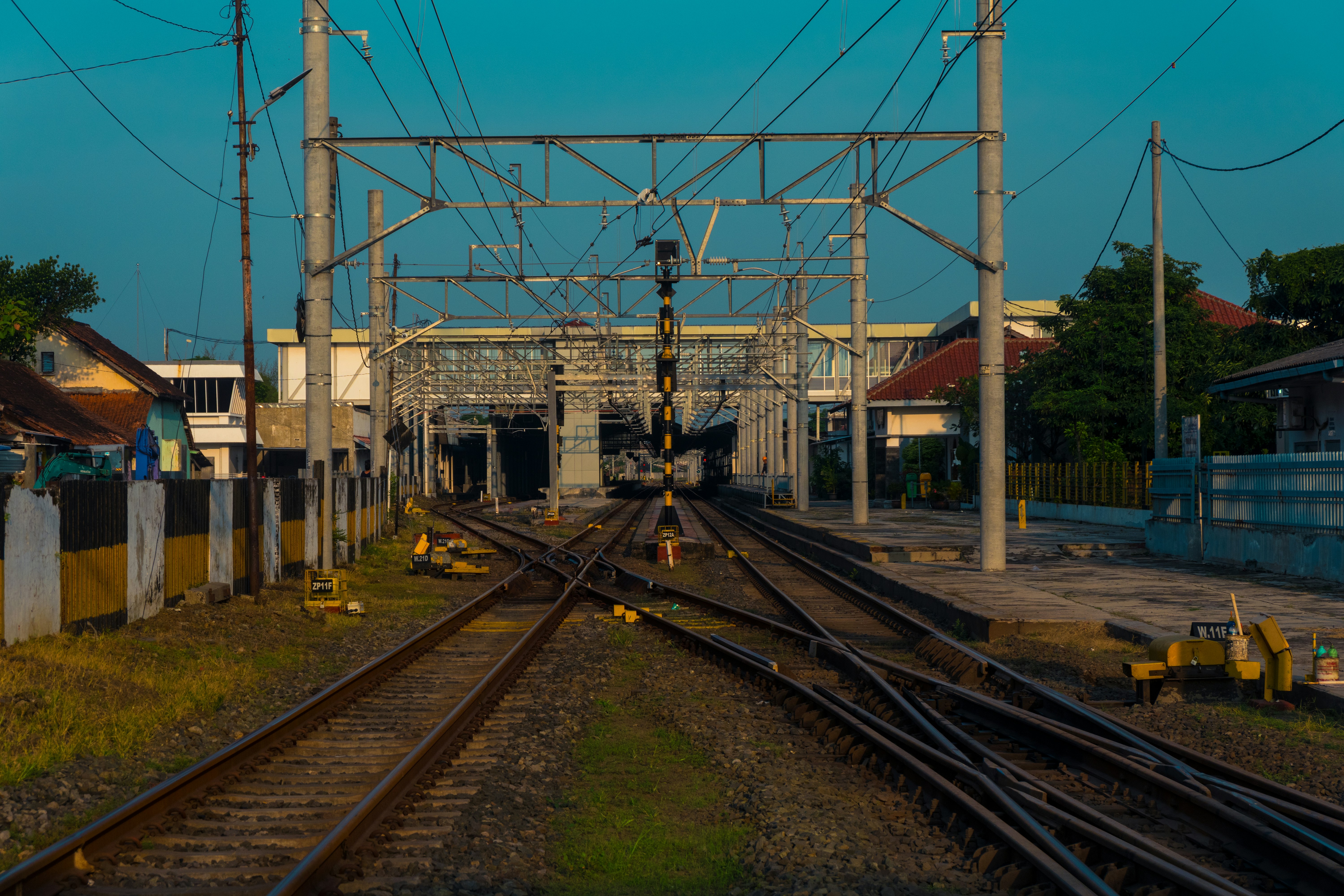 a train track with a building in the background