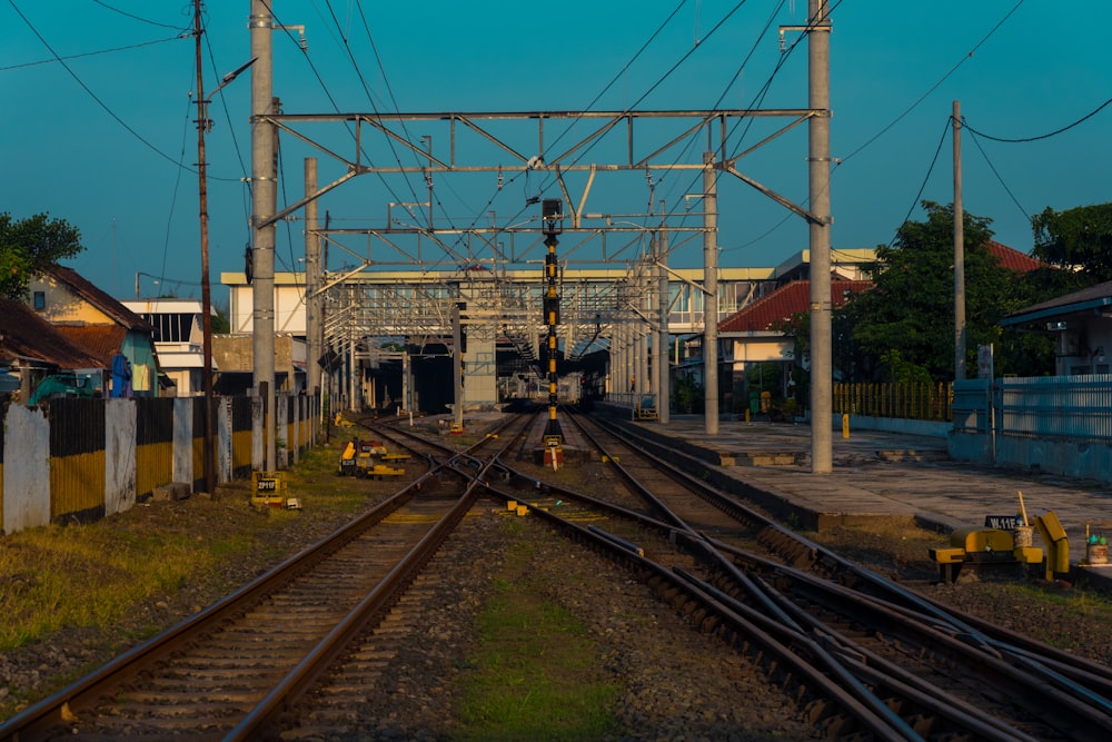 a train track with a building in the background