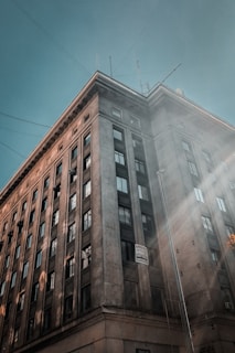 Animated image of a commercial building with spotless windows reflecting a sunny sky.