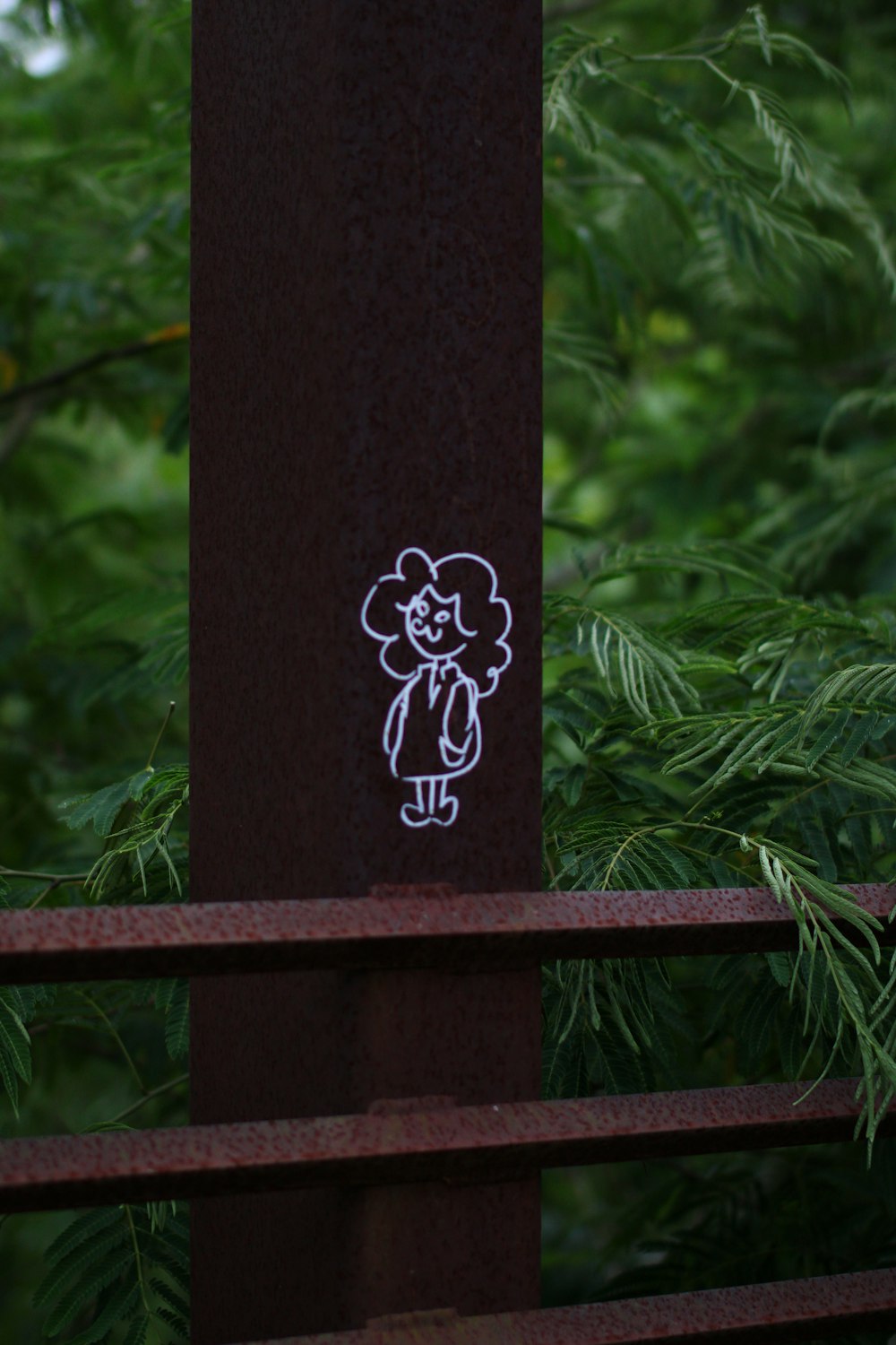 a picture of a sticker on a pole