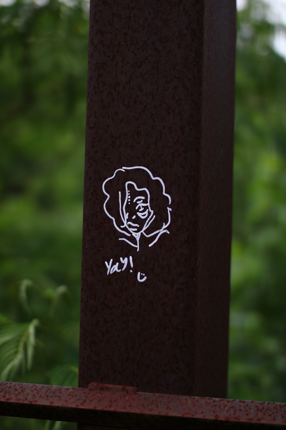 a close up of a sticker on a pole