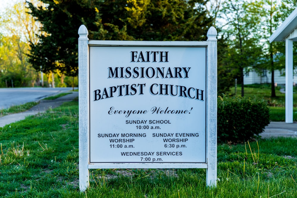a sign in front of a church that says faith missionary baptist church