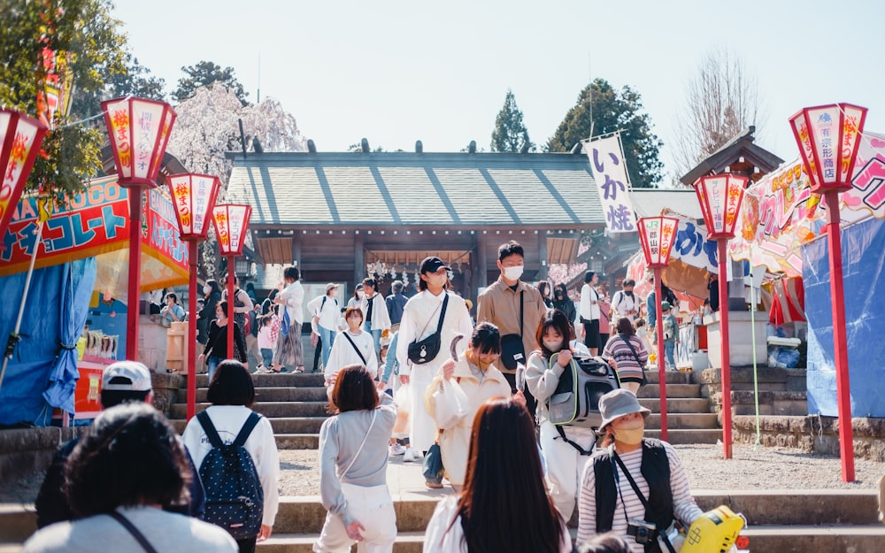 a group of people that are standing in front of a building