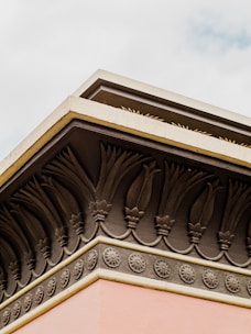 Close-up of durable decorative molding being installed on a building exterior.