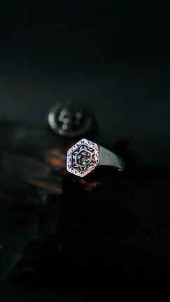Minimalist silver ring featuring a subtle engraved message, displayed on a clean white background