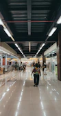Bright, clean shopping mall corridor showcasing shiny windows and spotless tiles.
