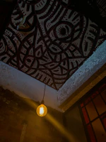 A warm-lit Indian living room featuring a Ryolite LED bulb glowing softly from the ceiling.
