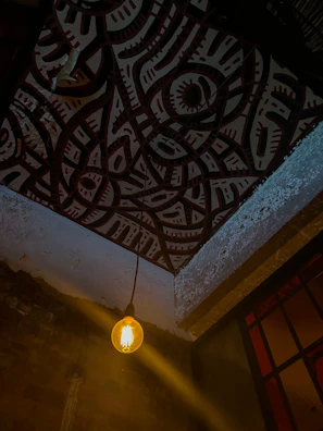 A warm-lit Indian living room featuring a Ryolite LED bulb glowing softly from the ceiling.