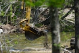 Excavators moving earth on a complex hydraulic project near a river