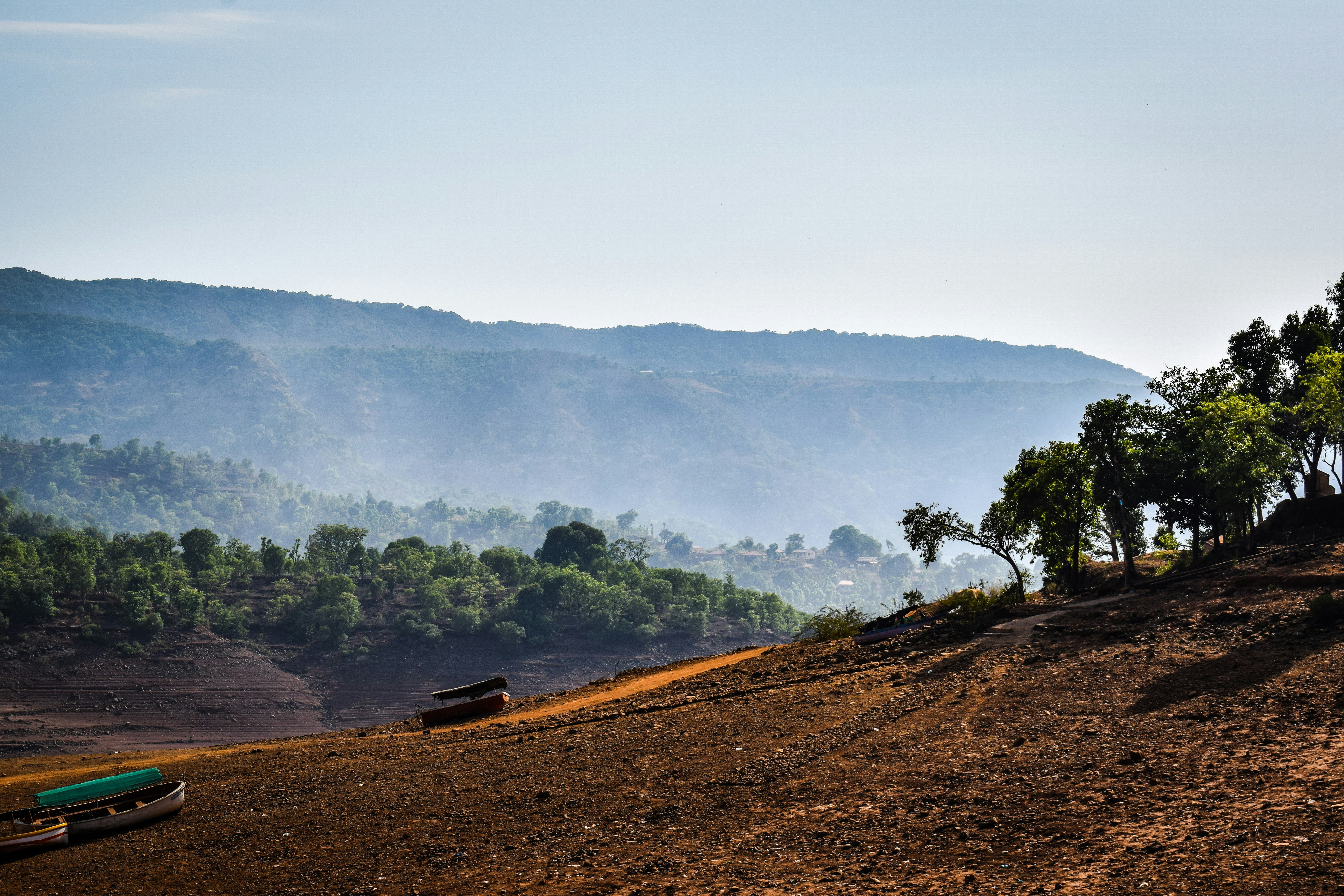 A generic photo of an open-cast coal mine in India, with large excavators and piles of coal, to represent the source of the illegal mining.