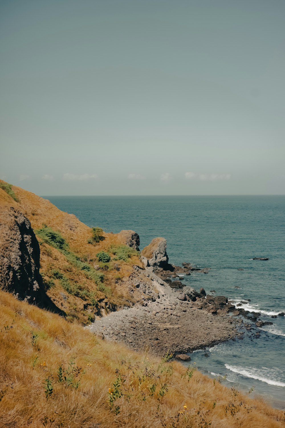 a view of a body of water from a hill