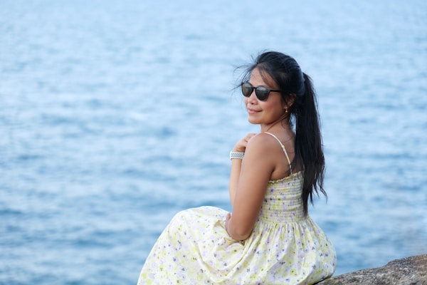 A casual outfit featuring a light summer dress on a sunny day.