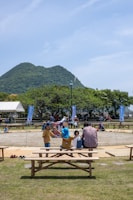 A scenic view of a cooperative event in a lush green setting.