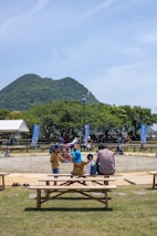 A beautiful landscape showing a community gathering for a charitable event.