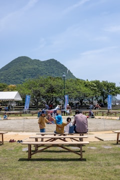 A scenic view of a choir festival in a park setting.