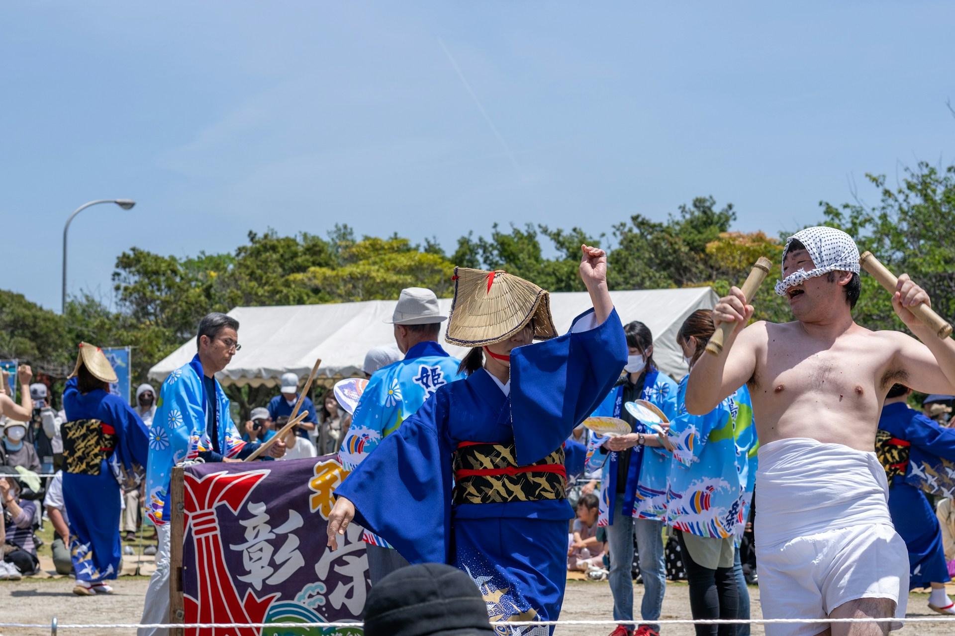 woman wearing yellow long-sleeved dress under white clouds and blue sky during daytime