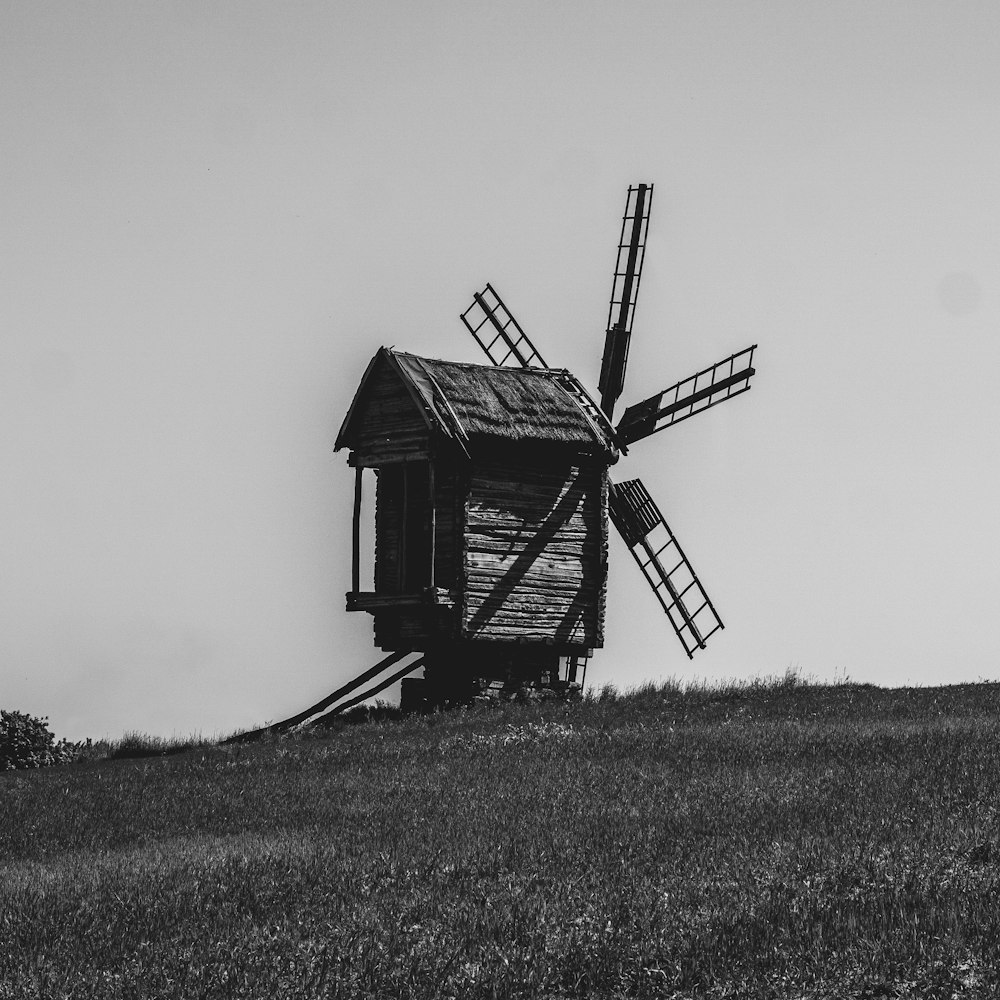 a black and white photo of a windmill