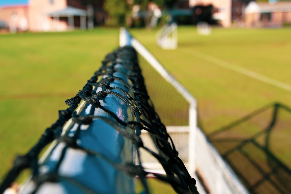 a view of a tennis court from behind a net