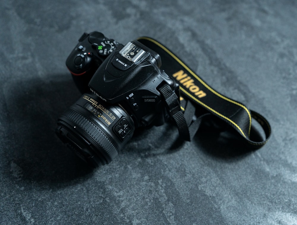 a camera with a nikon lens attached to it
