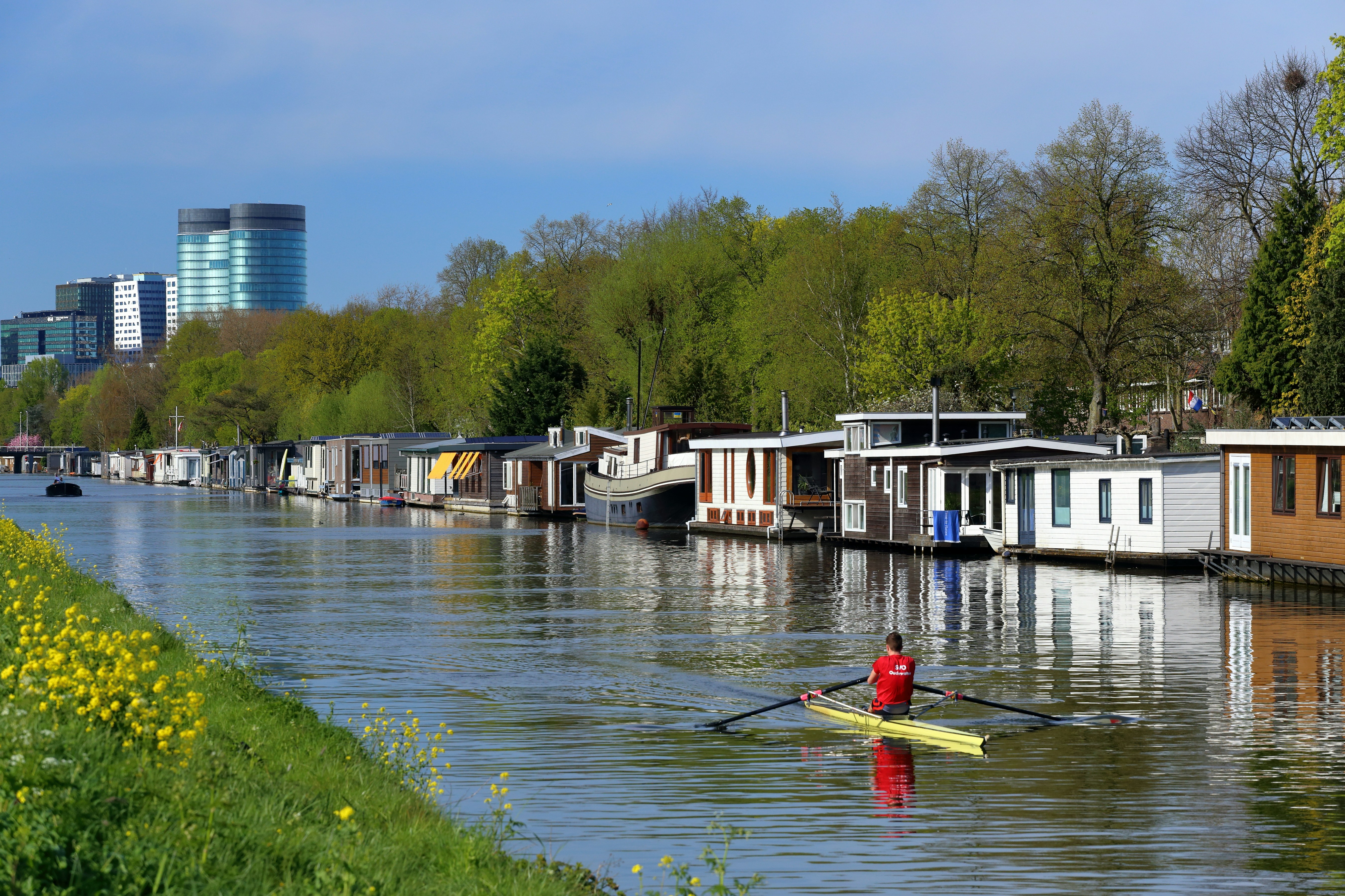 a man rowing a boat down a river
