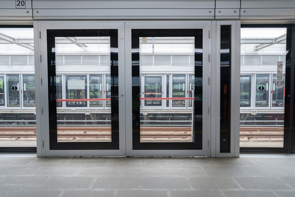 an empty train station with two doors open