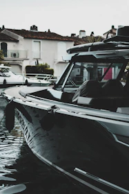 A sleek boat docked ready for adventure with sparkling water reflections