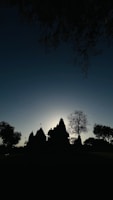 A scenic backdrop featuring a temple during sunset, enhancing the atmosphere.