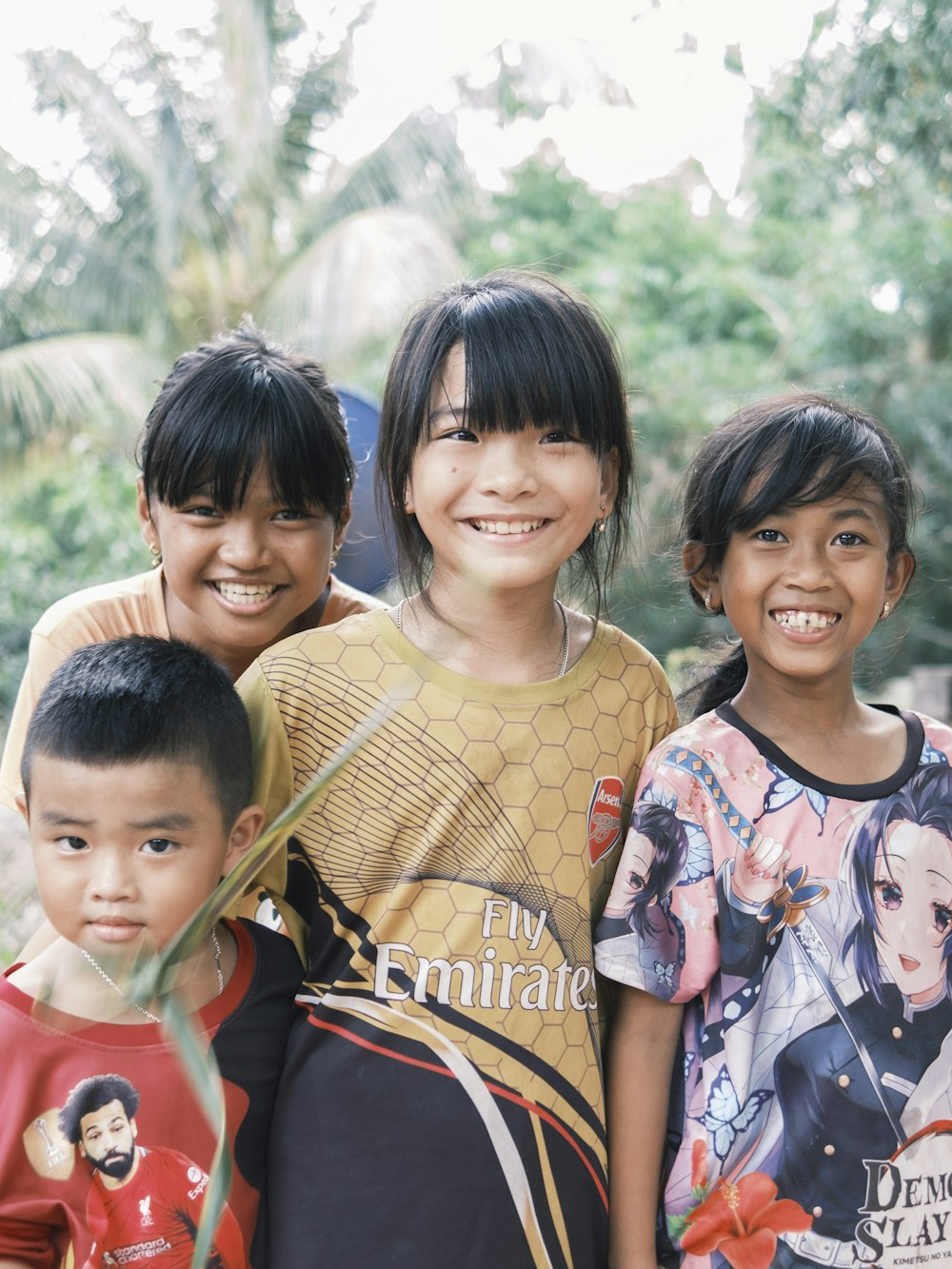 a group of young children standing next to each other