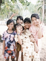 a group of young children standing next to each other
