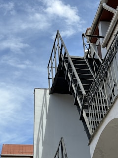 A metal staircase leading to a rooftop.