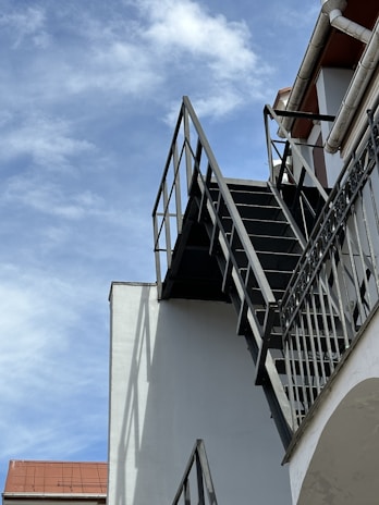 A metal staircase leading to a rooftop.