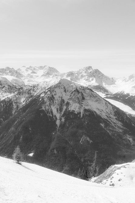 a man riding skis on top of a snow covered slope