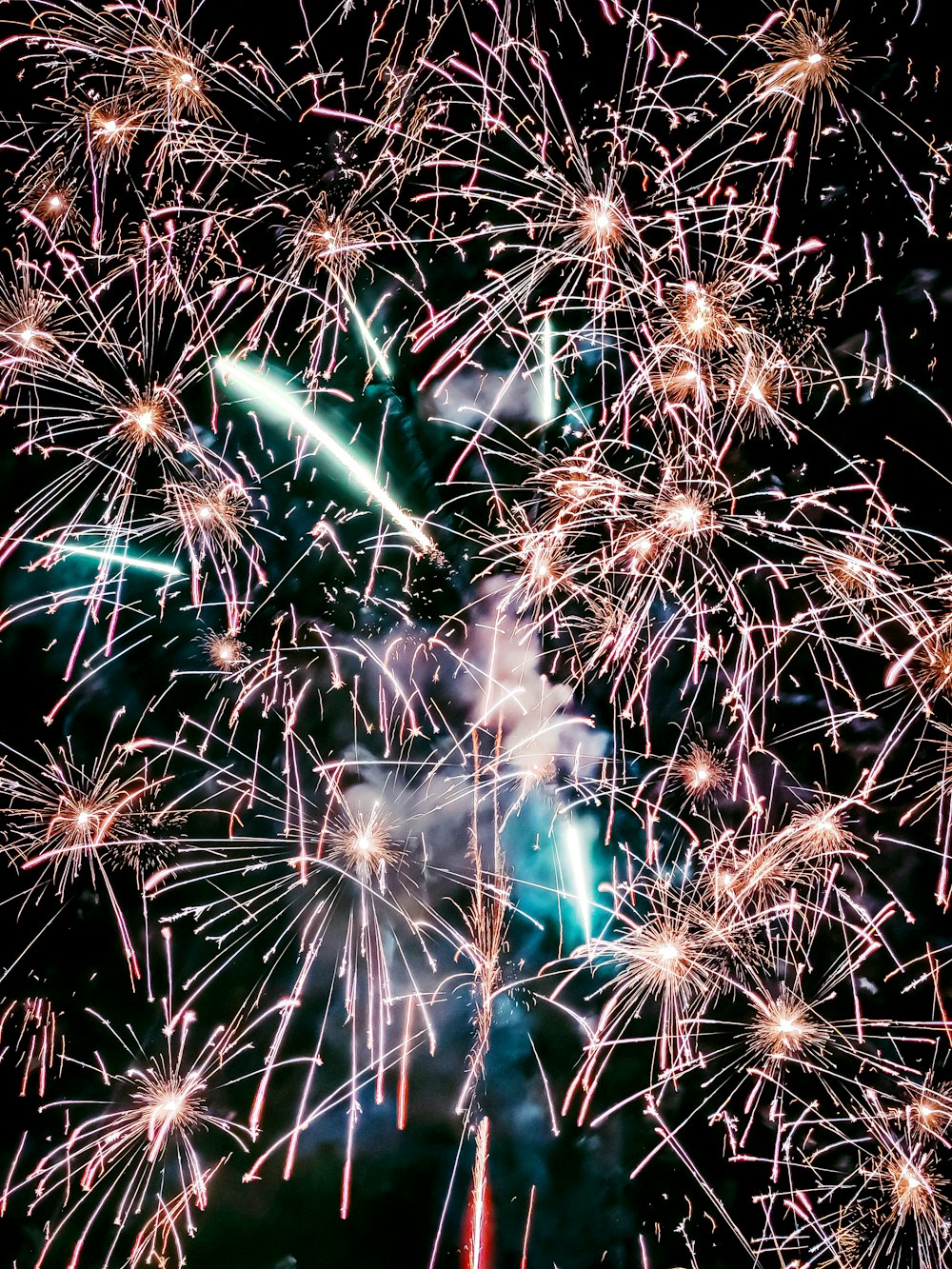 a bunch of fireworks are lit up in the night sky